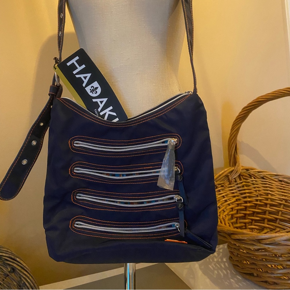 HADAKI purse New Orleans Navy Blue with orange accented striped pockets